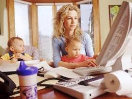 work From home-mother at computer with children
