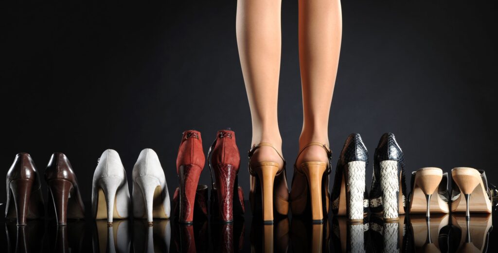 clothing she will love-row of shoes with lady standing in one pair